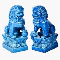 FOO DOGS, a pair, 40cm high, 15cm wide, 25cm deep, cobalt blue glazed ceramic. (2)