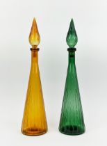 A PAIR OF ITALIAN STYLE DECANTERS, of conical form, one in green, the other in amber, each measuring