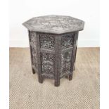 OCCASIONAL TABLE, Indian hardwood with all over carved octagonal top on folding supports, 56cm H x