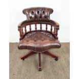 DESK CHAIR, brown leather with swivel seat on castors, 90cm H x 64cm.