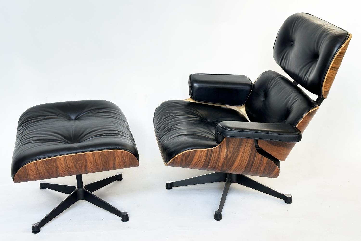 AFTER CHARLES AND RAY EAMES LOUNGE CHAIR AND OTTOMAN , vintage buttoned leather together with
