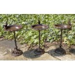 BIRD BATHS, a set of three, vintage style cast metal, each with a perching bird, 33cm H (3)