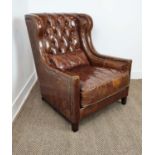 WING ARMCHAIR, close nailed and brown leather upholstered, 94cm H x 78cm W.