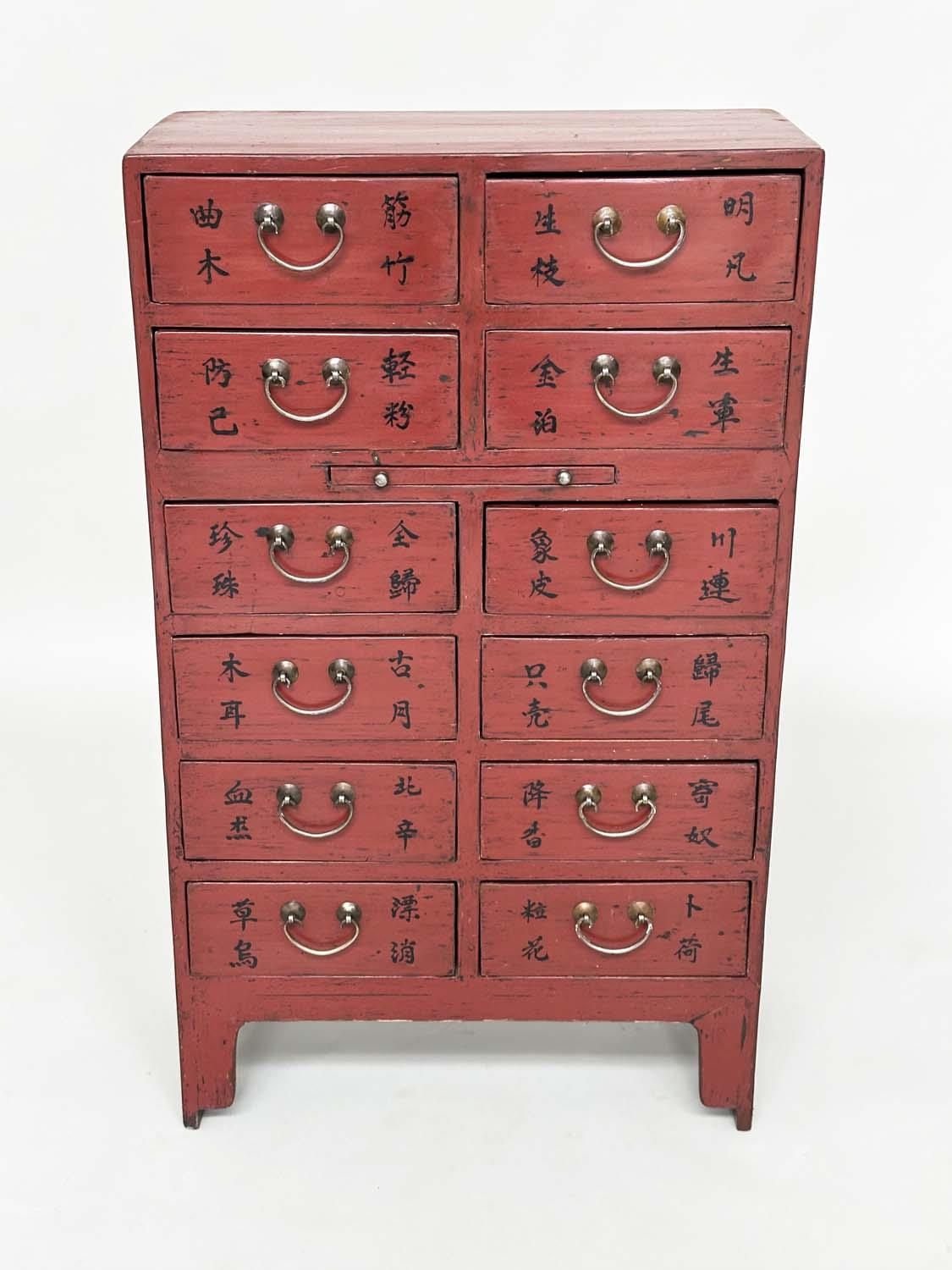 CHINESE CHEST, early 20th century scarlet lacquered with twelve short drawers, slide and silvered