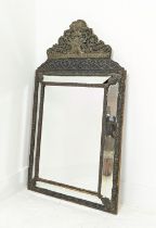 CUSHION MIRROR, 19th century Flemish repoussé brass frame with rectangular bevelled plate, flanked