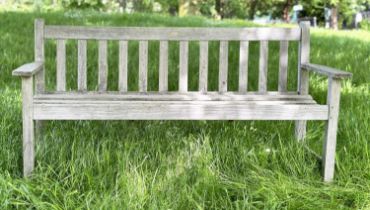 GARDEN BENCH, silvery weathered slatted teak, three seater with flat top arms, 82cm H x 158cm W.