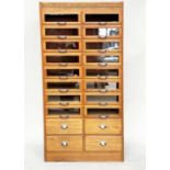 HABERDASHERY CABINET, mid 20th century oak with sixteen glazed drawers above four drawers, 199cm H x