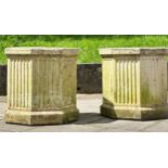 GARDEN PLANTERS, a pair octagonal well weathered composition stone with fluted panels, 52cm H x 52cm