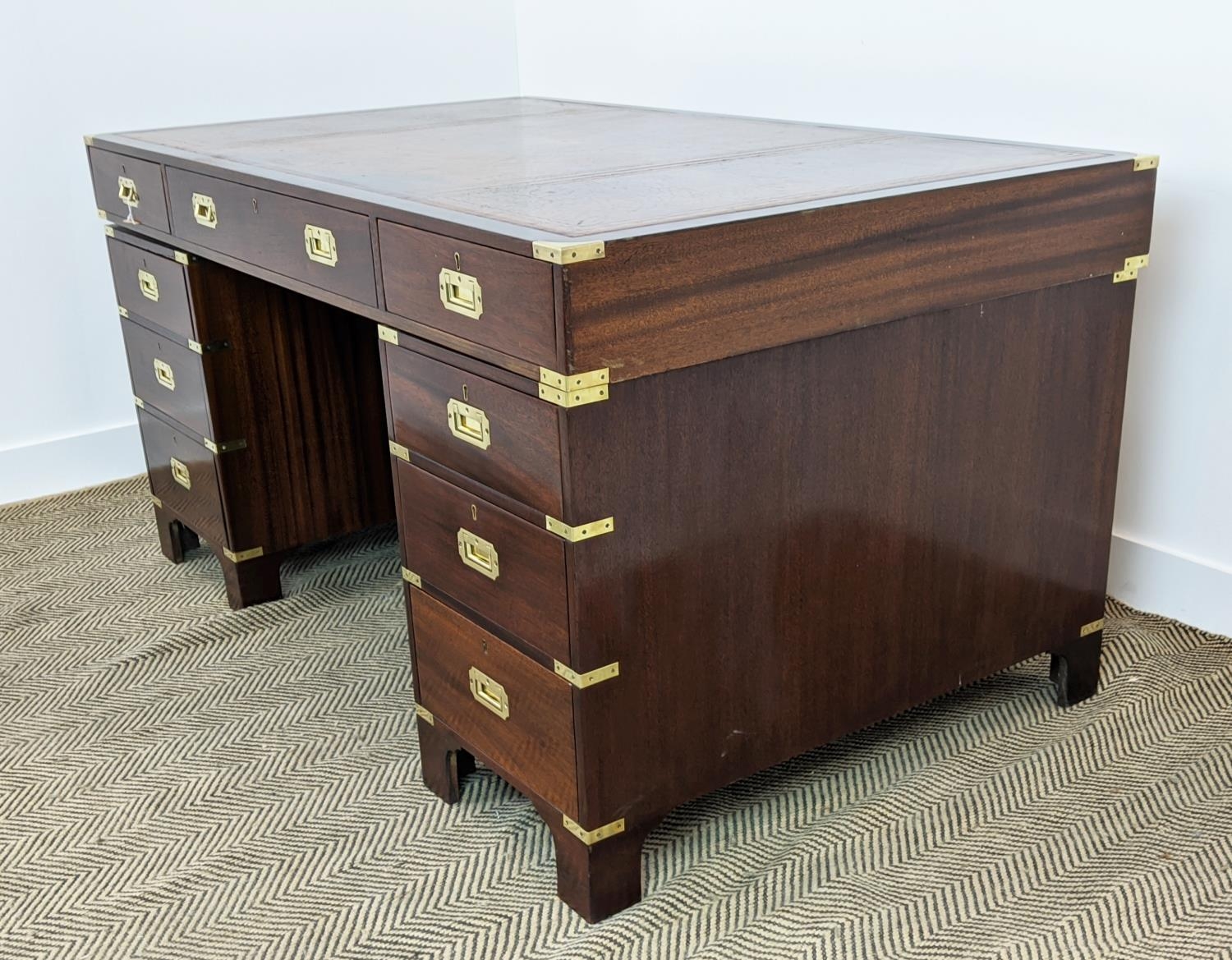 CAMPAIGN STYLE PEDESTAL DESK, mahogany and brass bound with brown leather top above nine drawers, - Image 4 of 11