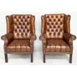 WINGBACK ARMCHAIRS, a pair, George III design natural antique tan brown brass studded leather