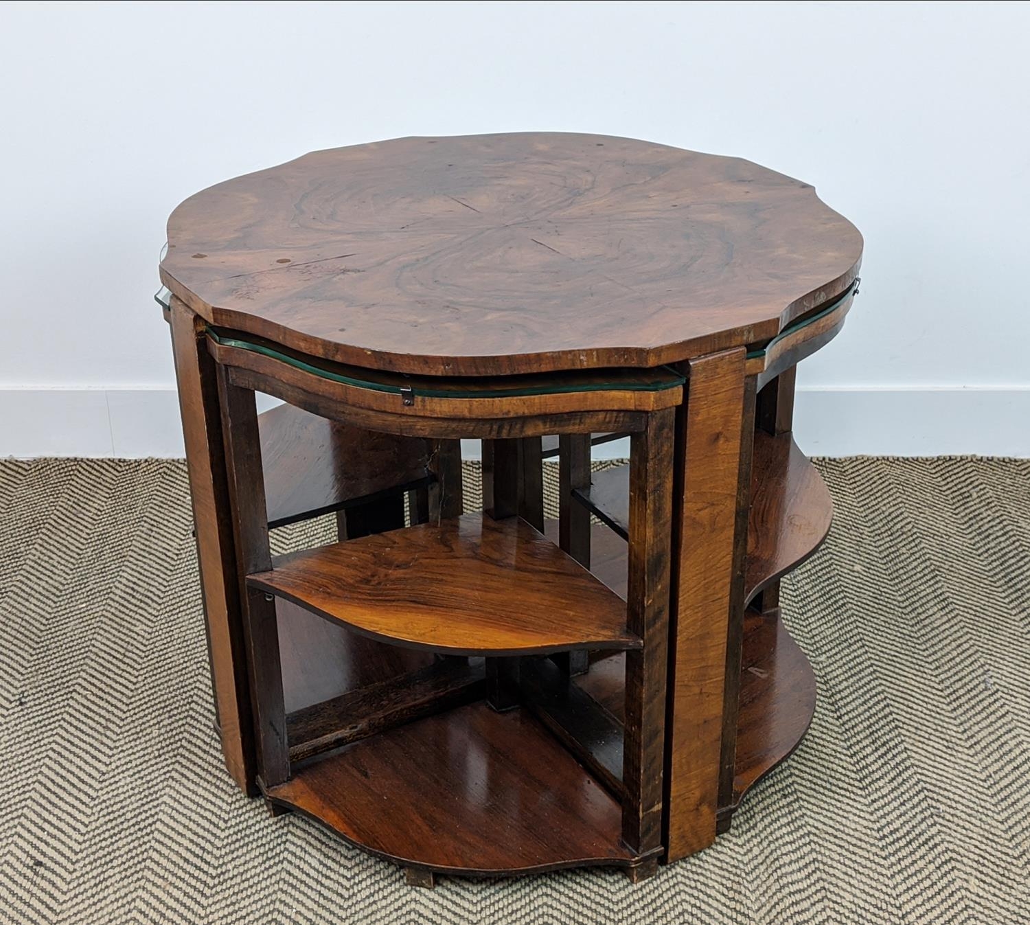 ART DECO OCASSIONAL TABLE, figured walnut with four nesting quadrant tables with shelves, 71cm W x