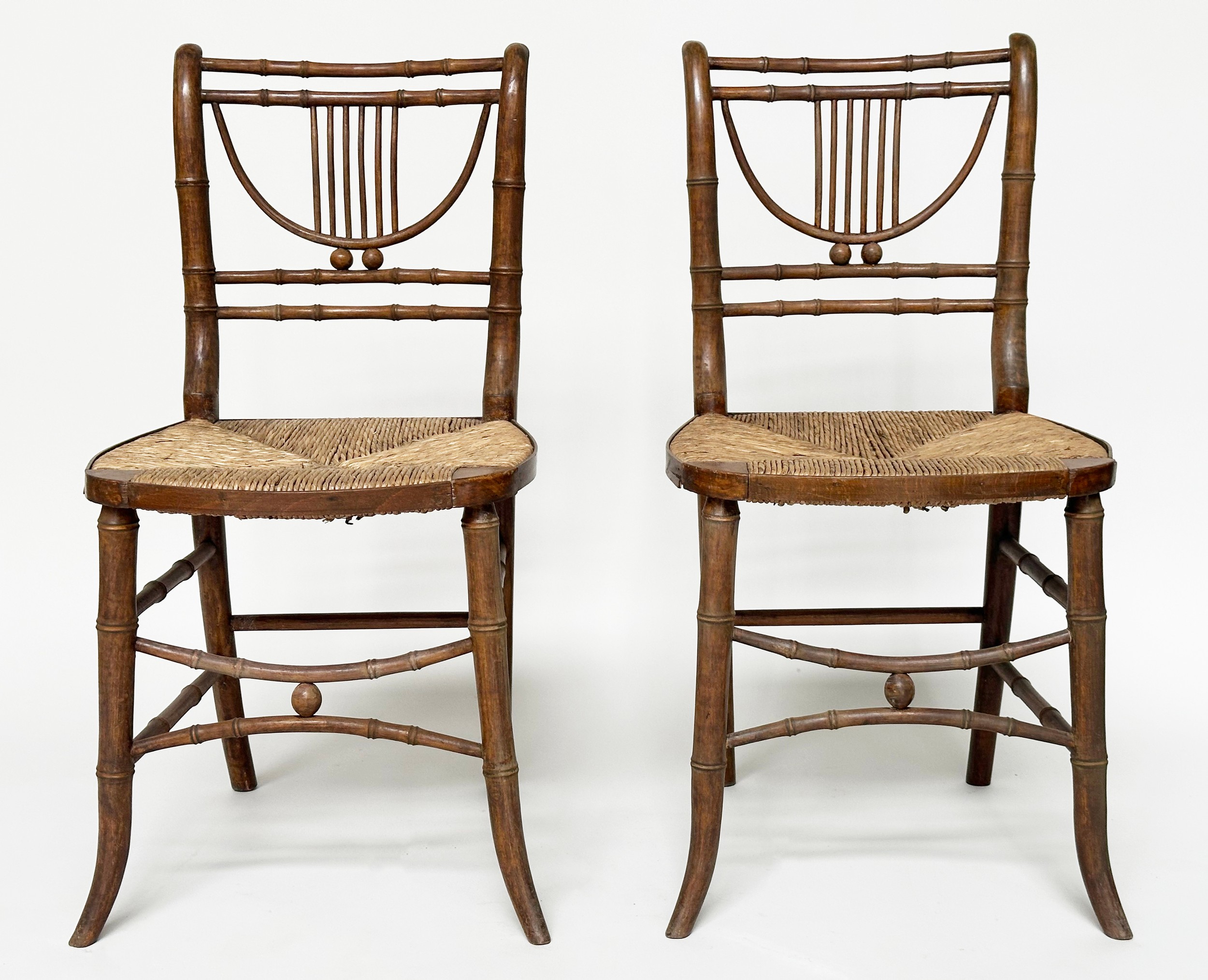 SIDE CHAIRS, a pair, Regency faux bamboo each with lyre backs, woven rush seats and swept - Image 3 of 20