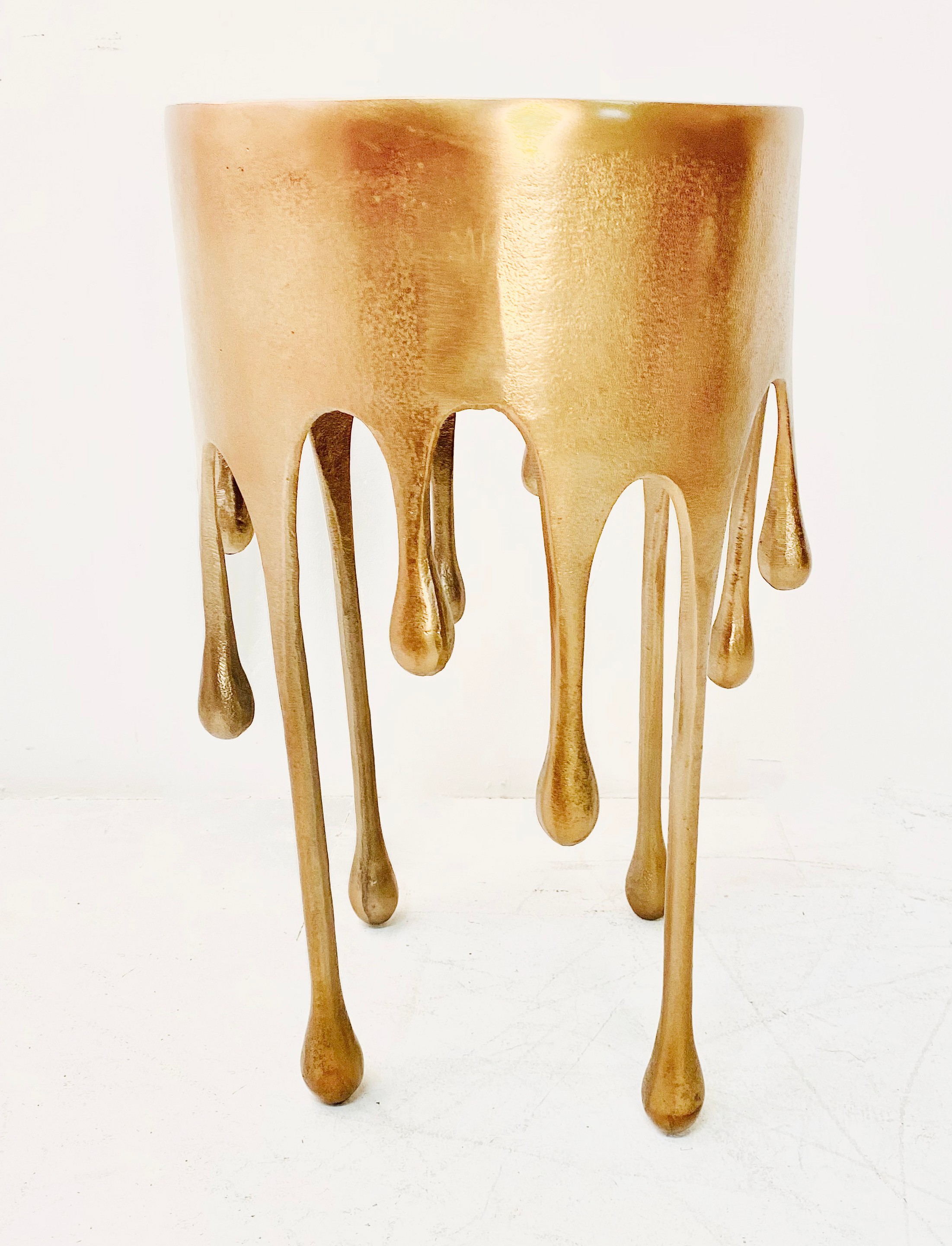 SIDE TABLE, surrealist style dripping design, gilt metal, 63cm x 37cm x 37cm.