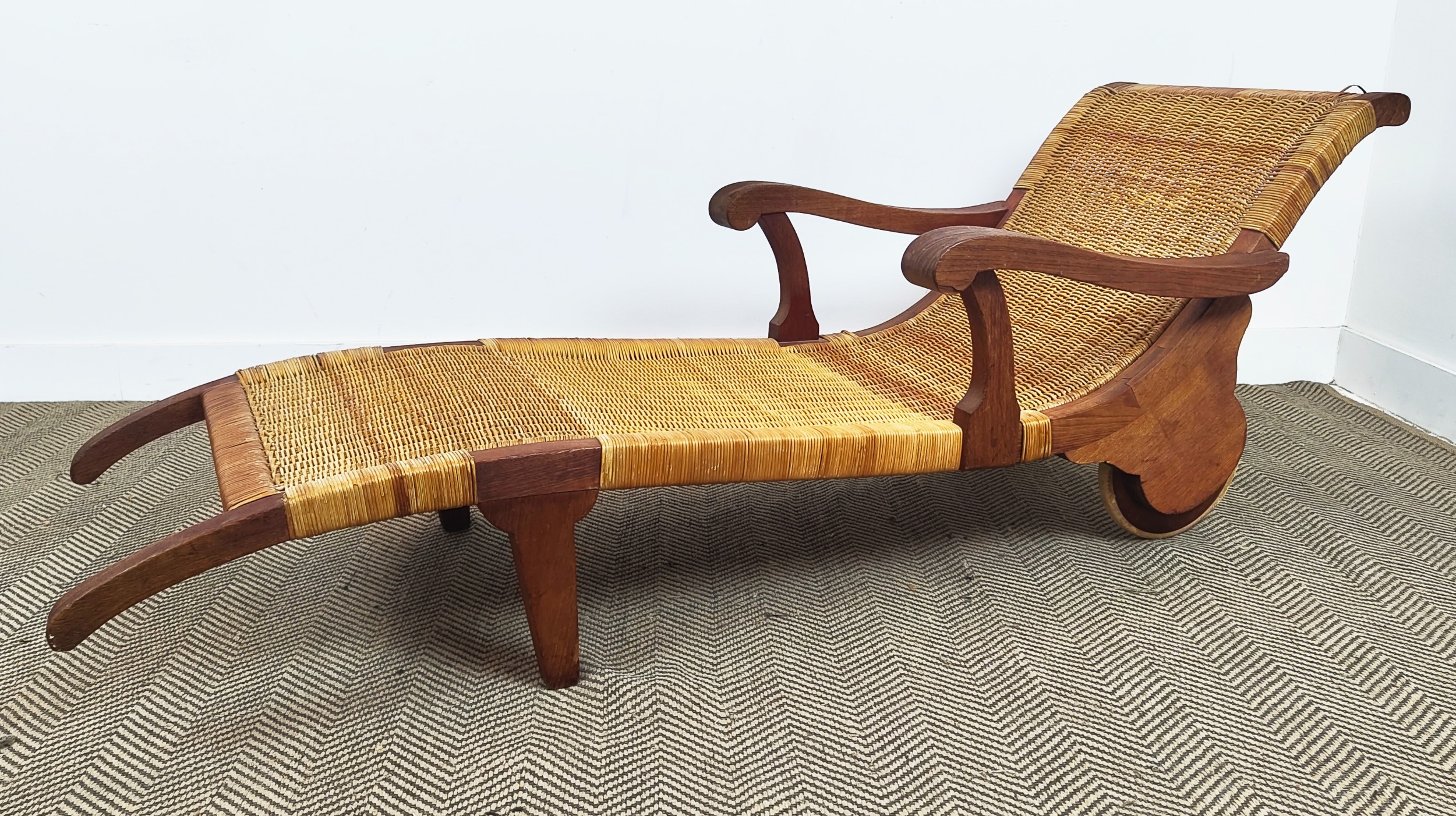 LOUNGER, bears plaque 'Dryad', hardwood and caned, 178L x 61cm W.