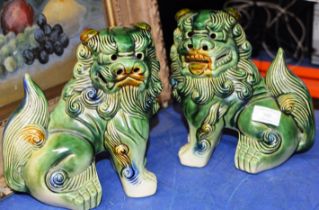 PAIR OF CHINESE POTTERY LION / DOG ORNAMENTS