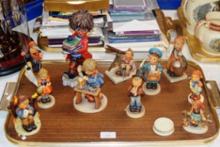 TRAY WITH LARGE HUMMEL / GOEBEL FIGURINE SIGNED MICHEL T & VARIOUS OTHER HUMMEL / GOEBEL FIGURINES