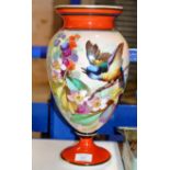 A HAND PAINTED PORCELAIN VASE