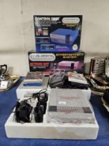 2 NINTENDO ENTERTAINMENT SYSTEMS WITH ORIGINAL BOXES, 6 VARIOUS GAMES, CONTROL PADS AND GUN