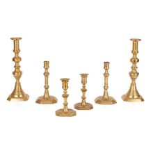 TWO PAIRS OF GEORGIAN BRASS CANDLESTICKS