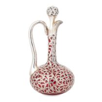 An early 20th-century cranberry glass claret jug