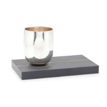 A contemporary tumbler and stand