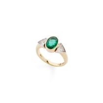 An emerald and diamond ring