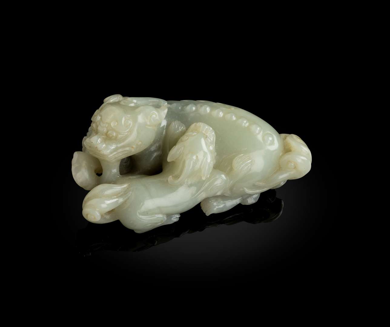 CELADON JADE CARVING OF A LION AND CUB