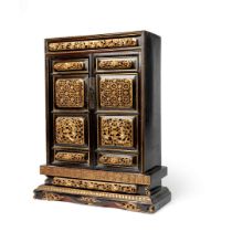 SMALL GILT-DECORATED AND LACQUERED WOODEN CABINET