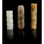 GROUP OF THREE JADE TUBULAR PENDANTS