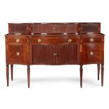 GEORGE III MAHOGANY AND INLAID SERPENTINE STAGEBACK SIDEBOARD