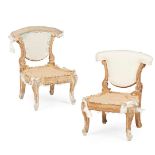 PAIR OF GEORGE II GILTWOOD LOW CHAIRS, IN THE MANNER OF WILLIAM KENT