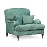 EDWARDIAN UPHOLSTERED EASY CHAIR, IN THE HOWARD STYLE