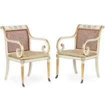 PAIR OF REGENCY STYLE CREAM PAINTED AND PARCEL-GILT ARMCHAIRS