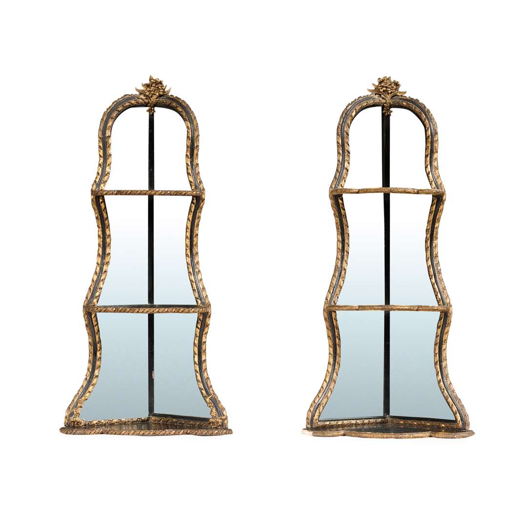 PAIR OF EBONISED AND PARCEL GILT MIRRORED HANGING CORNER SHELVES