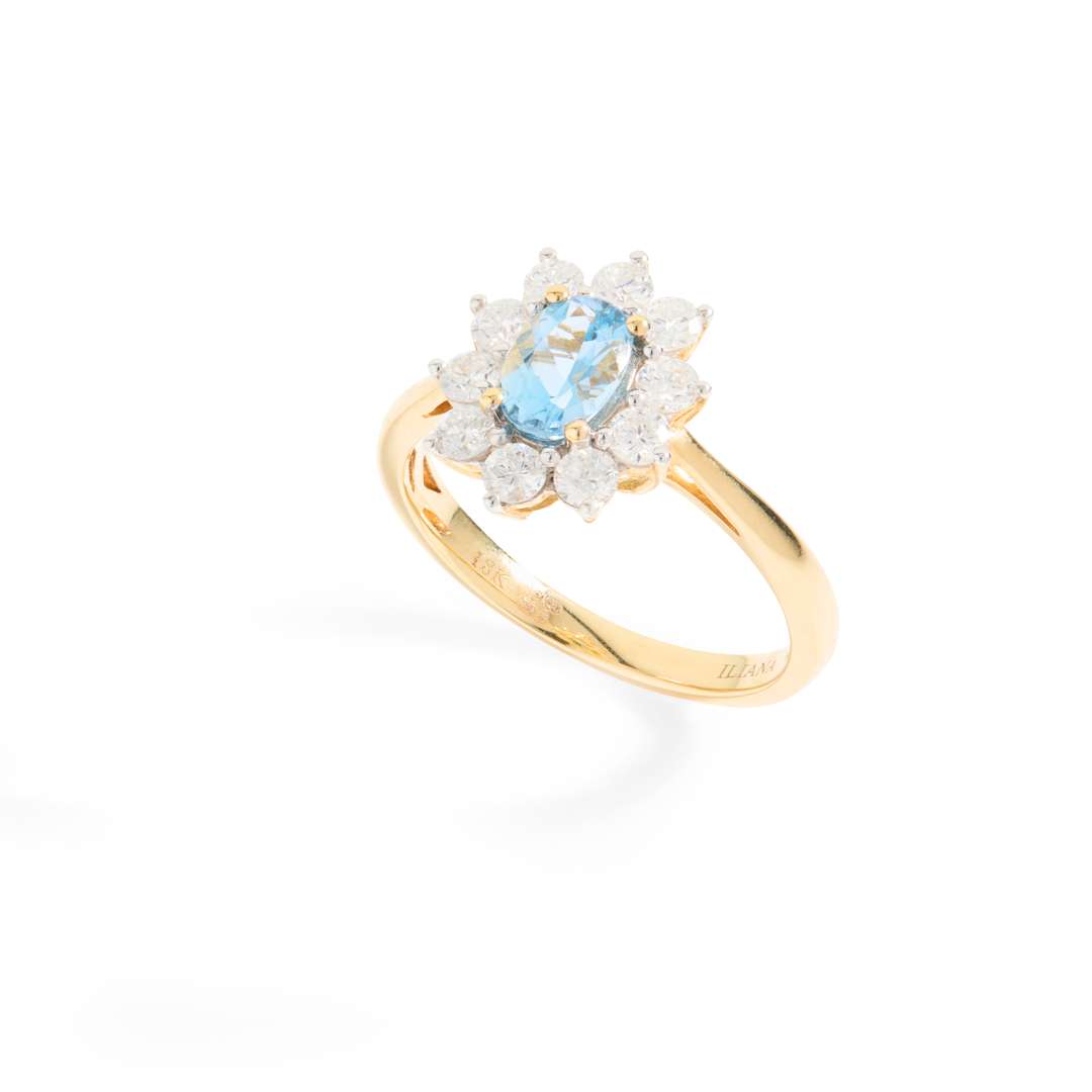 An 18ct gold aquamarine and diamond cluster ring