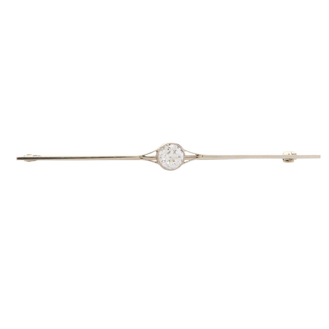 A diamond single-stone bar brooch