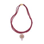 A ruby bead necklace and pendant