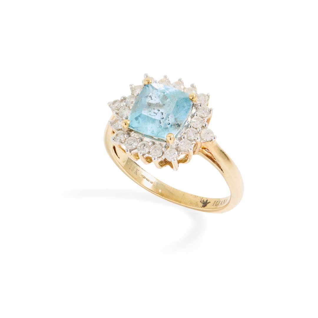 An 18ct gold aquamarine and diamond cluster ring