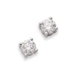 A pair of diamond stud earrings