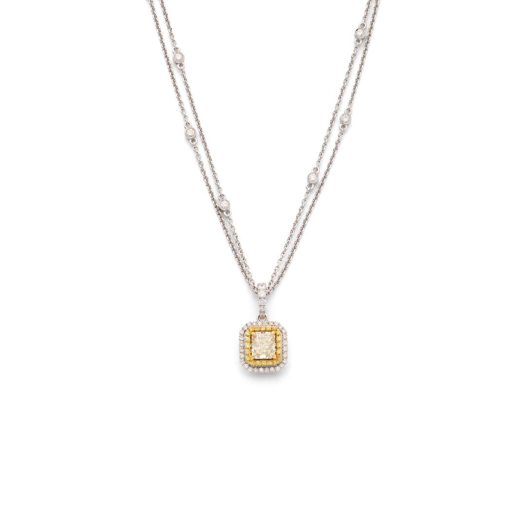 A fancy yellow and colourless diamond pendant