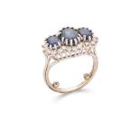 A sapphire and diamond triple-cluster ring