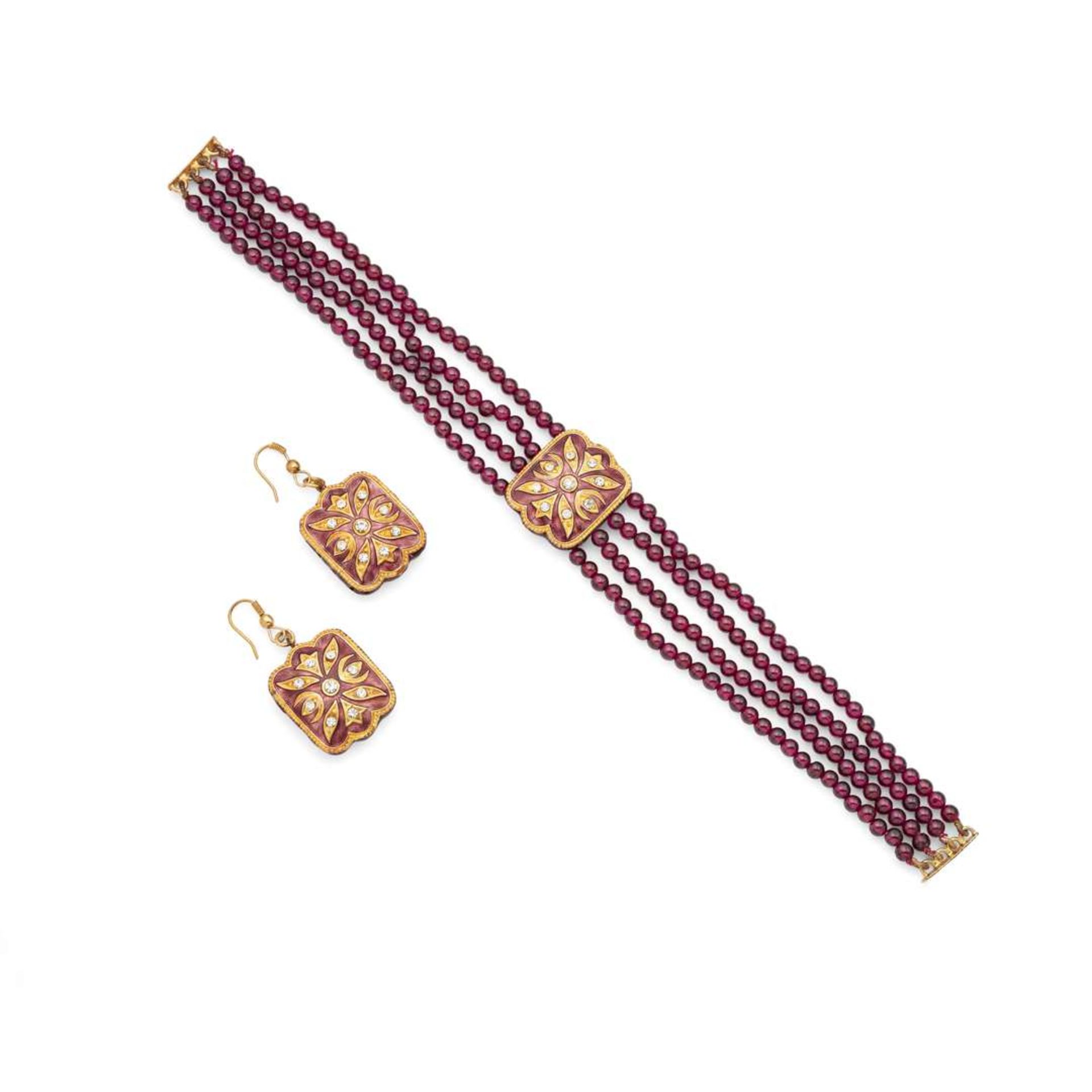 An Indian style ruby, enamel and paste necklace and matching earrings