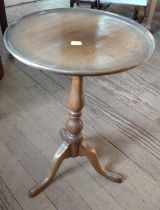 A reproduction tripod table. 52cm x 35cm