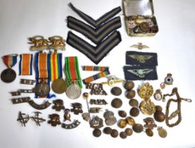 A collection of WW1 and WW2 militaria medals including a Victory Medal for the First World War