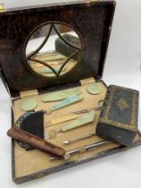 A mid 20th century cased ladies vanity / manicure set with green resin handles, together with a late