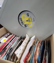 A quantity of 7" singles and two 12" singles including The Clash, David Bowie, The Damned,