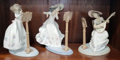 Three Lladro lady musicians, 20cm to 24cm (3)