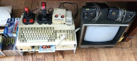 An AMIGA Games Consul, x14 games plus accessories with a Fidelity monitor. Including in this Lot