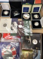 A collection of coins including a Brexit limited edition commemorative cover,