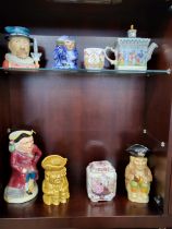 A Sadler Championships teapot, a canister, 14cm, Diamond Jubilee cup and five character jugs. (8)